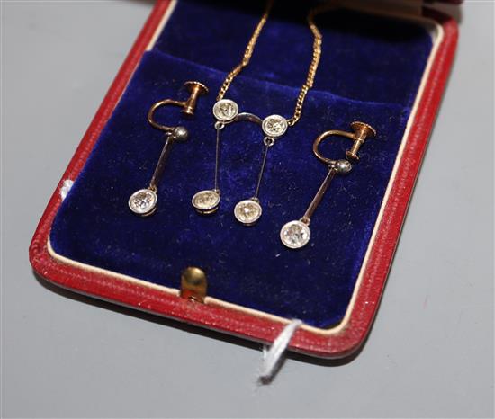 A four-stone diamond, yellow metal negligee necklace on fine 9ct chain and a similar pair of 15ct and single stone earrings.